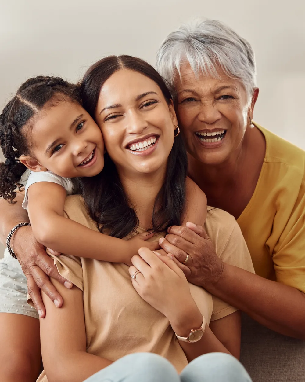 Smiling family seated together at home