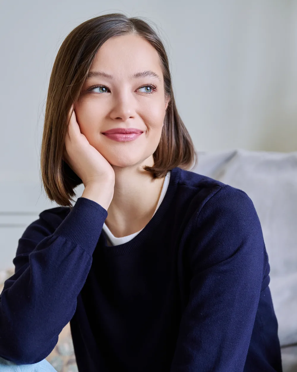 Woman relaxing on a couch in a calm home setting