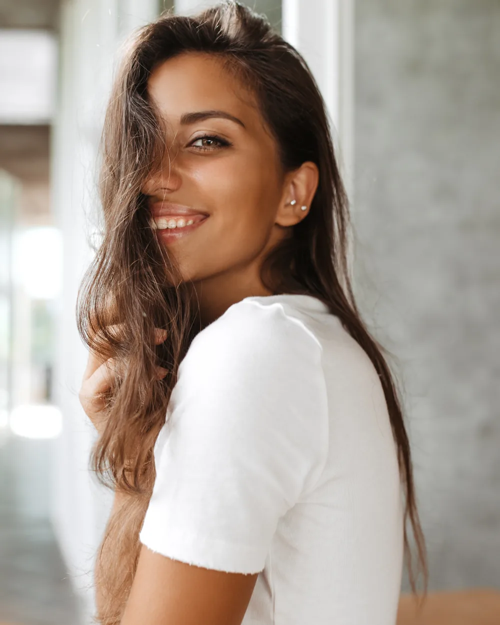 Smiling woman in a white shirt